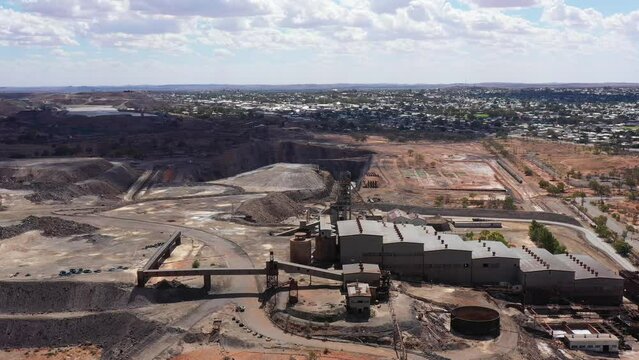 Deep excavated open pit Junction mine in Broken hill city of outback as 4k.
