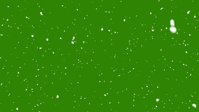 Snow falling on green background