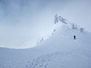 Winter in the mountains. Hiking during wintertime. Snow storm in the high mountains