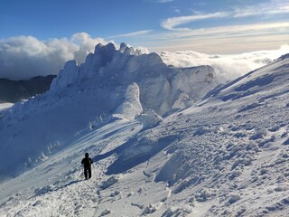 Winter in the mountains. Hiking during wintertime. Snow storm in the high mountains