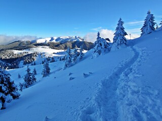 Winter in the mountains. Hiking during wintertime. Snow storm in the high mountains