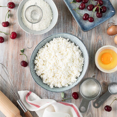 Step 1. The process of cooking dumplings. Homemade cottage cheese dumplings with cherry sauce on a wooden background. A traditional Ukrainian dish.