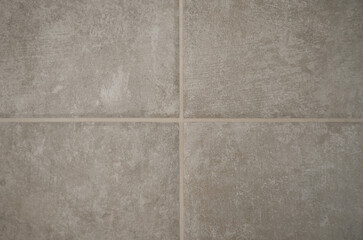 Fototapeta premium Tile seam close-up, gray tile