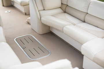Leather white and beige seats on a luxury yacht - obrazy, fototapety, plakaty