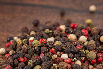 Colored peppers mix on the wooden background