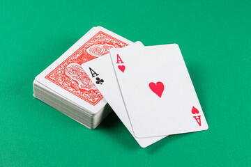 Playing cards on green background.