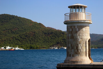 Fototapeta na wymiar Lighthouse in the marina