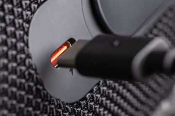 Closeup of USB Type C connector and black cable being connected