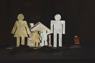 Paper woman and a man on a home fire background.