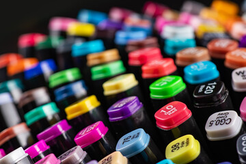 Multi-colored markers with a signed color number on the cap