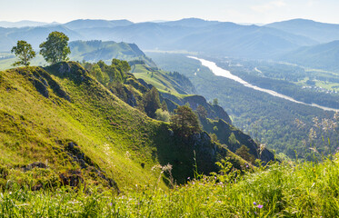Fototapeta premium Mountain view, valley with river in morning light