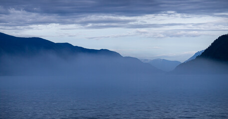 Morning fog on a mountain lake, natural light