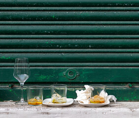 Front view of empty glasses and drink glasses after a street party