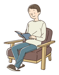 茶色のソファに座り読書をする男性