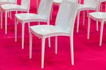 White chairs on a conference room. Modern business workspace indoor.