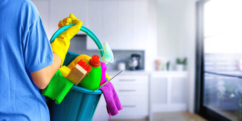 Cleaning lady with set of cleaning supplies on blurred background. in bathroom or toilet. Woman. - obrazy, fototapety, plakaty
