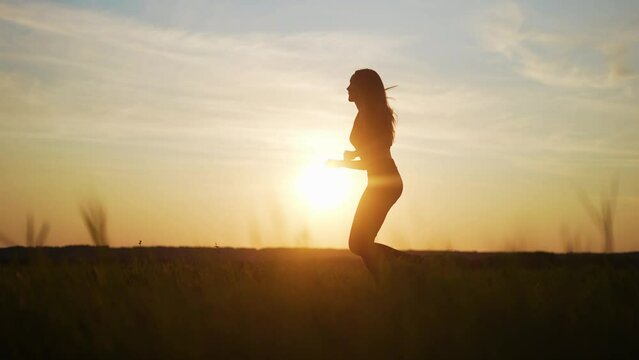 woman runner. girl silhouette running fast a outdoor sports. fitness marathon in the park running. free woman run runs sunlight in nature side view. training goal achievement success concept