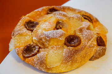 Ensaimada dels Darrers Dies, decorated with sobrassada and pumpkin, typical of the last days before...