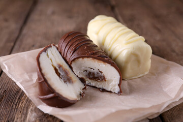 Homemade glazed curds in white and milk chocolate