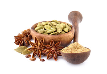Cardamon, anise and powder in wooden spoon isolated on white background. Spices isolated.