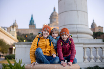 Children, playing in front of the Catalona national museum MNAC on Montjuic mountain in Barcelona