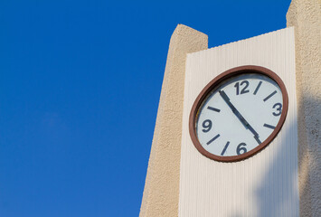 The large clock tower shows the city's time during the day and the beautiful sky.
