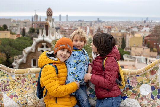 Family, children, posing in park Guell in Barcelona