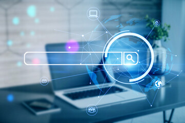 Close up of workplace with laptop, other items and digital search bar hologram and polygonal globe....