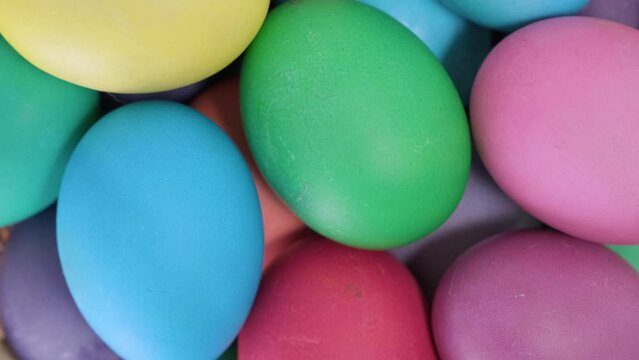 Easter colorful background of rotating chicken eggs. Multicolored egg for Happy easter