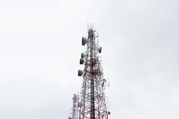 Antenna communication technology wireless concept with satellite dish dark sky raining is background. Tower connect to data of smart city. Telecommunication 5G Digital Transformation, Internet.