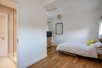 Fototapeta na wymiar White Bedroom with oak flooring