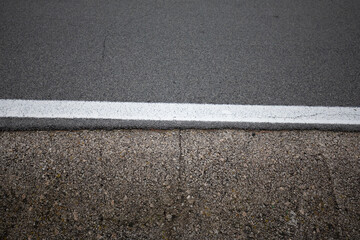 Fototapeta premium asphalt road surface and ditch texture with lines