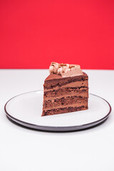 Homemade chocolate cake topped with whipped ganache