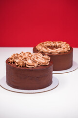 Homemade chocolate cake topped with whipped ganache