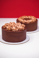 Homemade chocolate cake topped with whipped ganache
