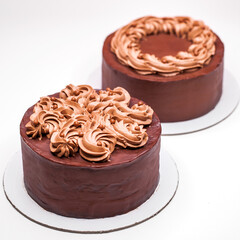 Homemade chocolate cake topped with whipped ganache
