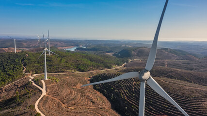 Aerial view wind turbine eco friendly renewable energy concept on Portuguese mountains background.