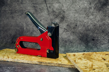 Metal furniture (industrial) stapler, close-up shot, useful tool for home