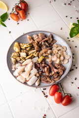 selective focus. raw seafood sea cocktail. mussel meat, squid, octopus, shrimp. spread out on a plate