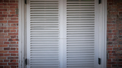 white closed mullion in brick wall - used as background