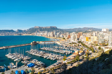 Obraz premium Maritime port seen from the Peñón de Ifach Natural Park in the city of Calpe, Valencia, Valencian Community. Spain. Mediterranean sea. Cantal Roig Beach, La Fossa Beach and Las Salinas