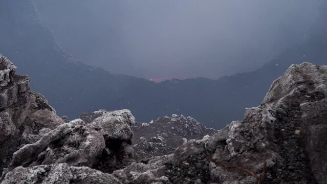 Down crater of the Masaya volcano in western Nicaragua and caldera, Handheld looking down shot