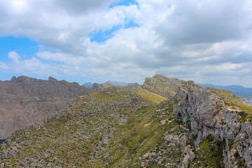 Nice landscape with mountains and beautiful cloudy sky. Summer hike up the mountain