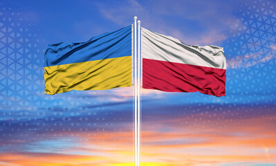 Ukraine and Poland two flags on flagpoles and blue sky..
