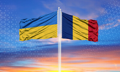 Romania and Ukraine two flags on flagpoles and blue sky..