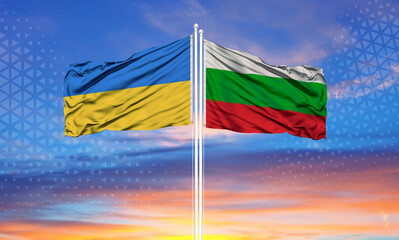 Ukraine and Bulgaria two flags on flagpoles and blue sky..