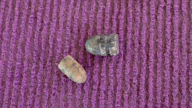 The 9mm and 11mm bullets are old and soiled.