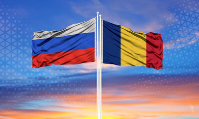 Romania and Russia two flags on flagpoles and blue sky..