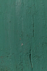 Surface of an old turquoise wooden board. Close-up. Vertical. Background. Space for text.