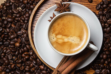 Espresso coffee on the background of coffee beans. Tonic drink. Cup of natural coffee